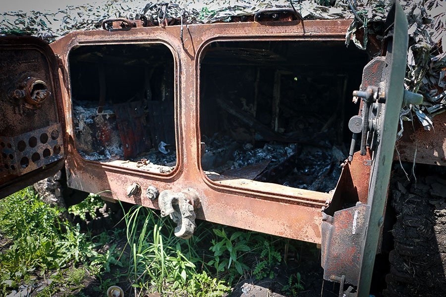 National Guards soldiers demonstrate burned Russian MT-LB, describe its destruction