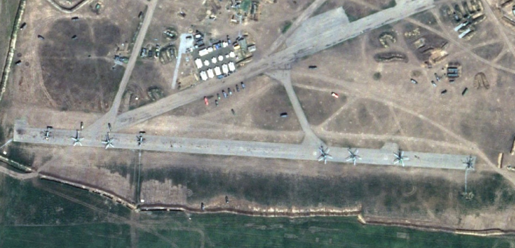 Russian military accumulate equipment at the Chaplynka airfield