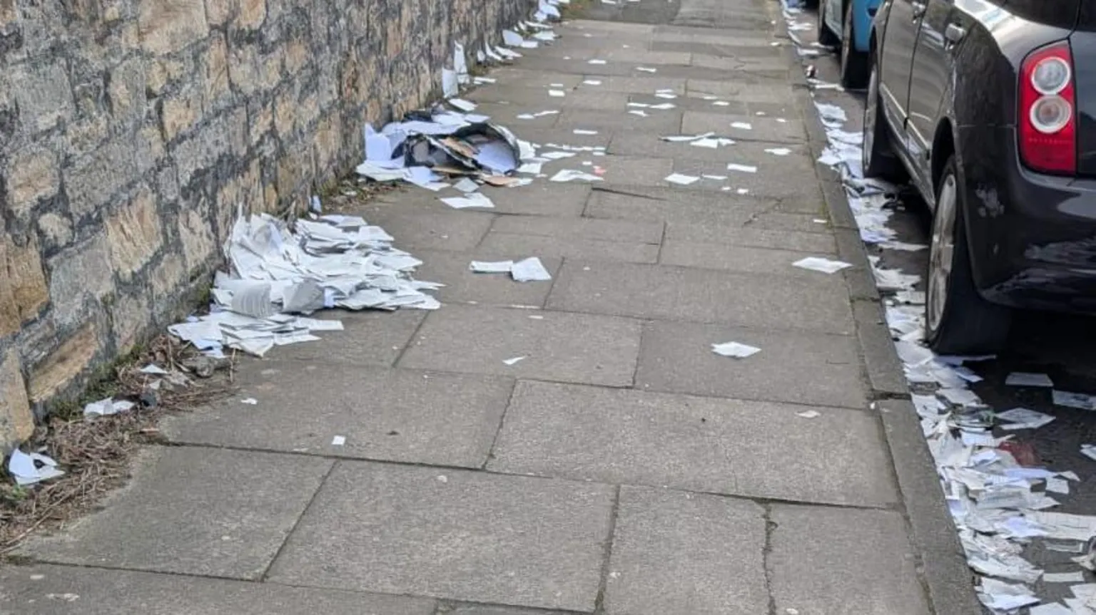 Classified documents spilled out of a black bin bag on a Newcastle street. Photo credits: BBC