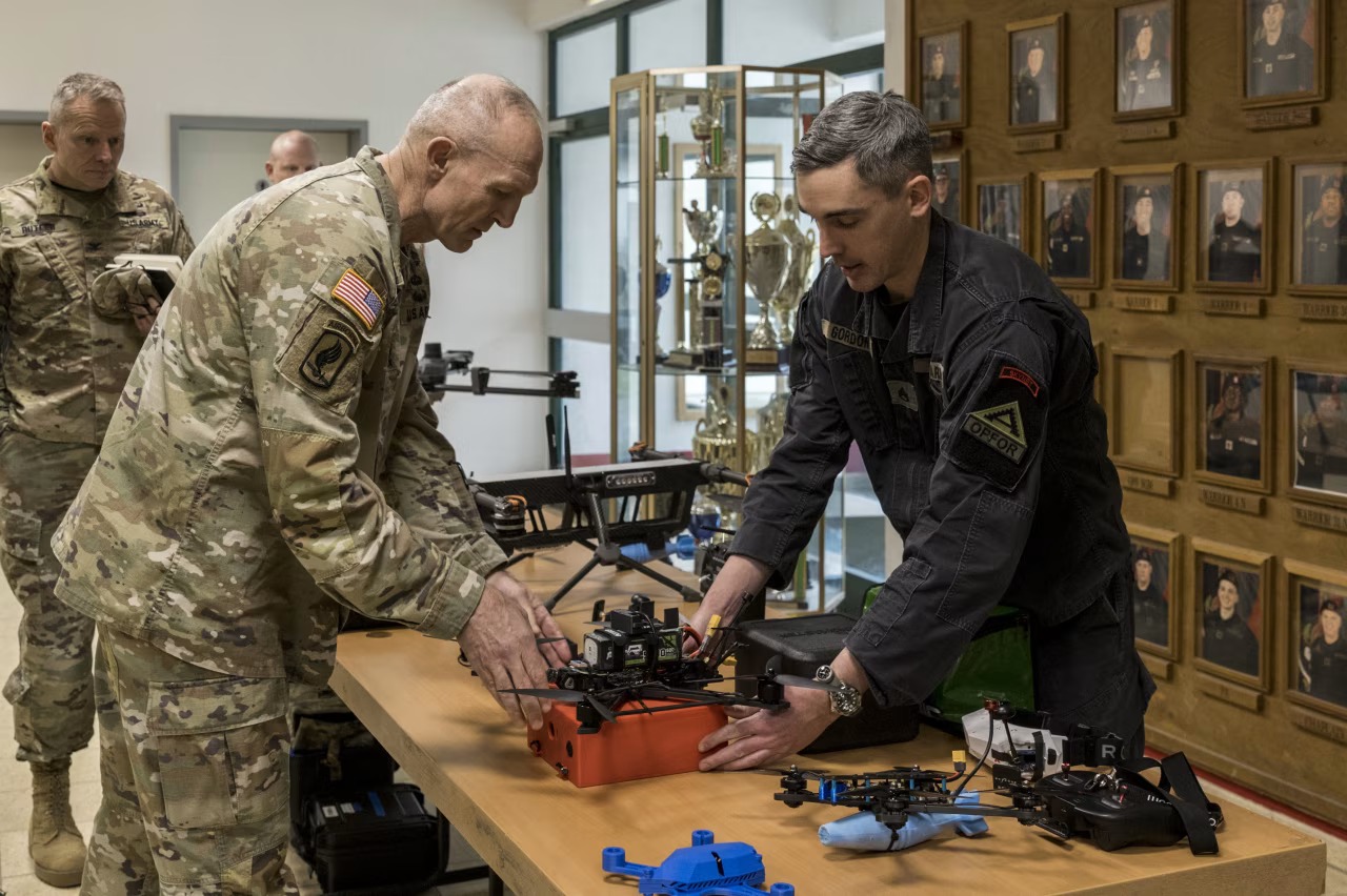 US Army Chief of Staff Gen. Randy George (left) inspects an FPV drone. Photo credits: The Wall Street Journal