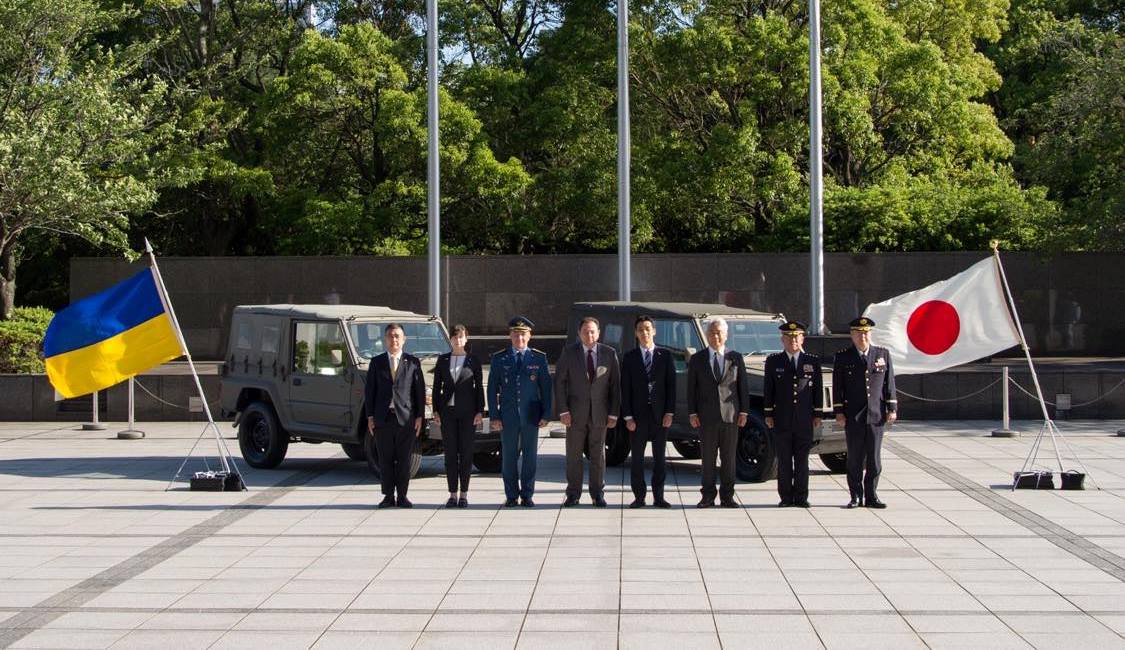 Representatives of Ukraine and Japan in front of Type 73 II off-road vehicles. May, 2023. Japan. Photo credits: Ministry of Foreign Affairs of Ukraine