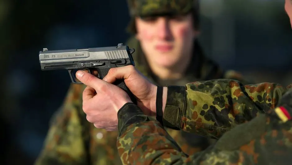 A German soldier with an HK P8 pistol. Photo credits: Heer
