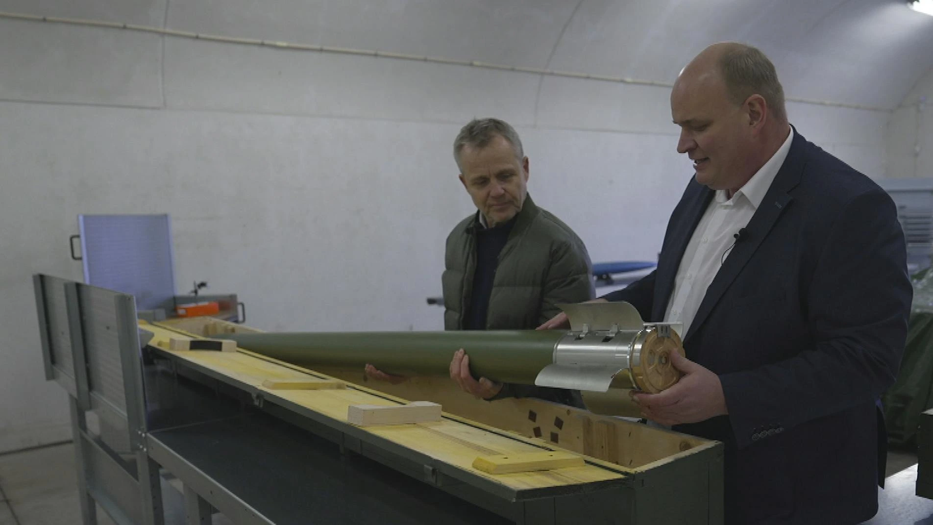 CEO Michael Kjær Sørensen shows one of the missiles to be produced at the future factory in Vandel. Photo credits: TV 2