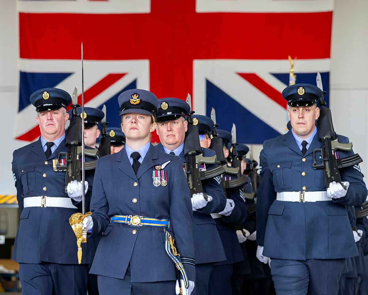 An officer of the 13th Squadron, Royal Air Force, leads a formation of service personnel during a ceremonial parade at RAF Waddington. Photo credits: RAF