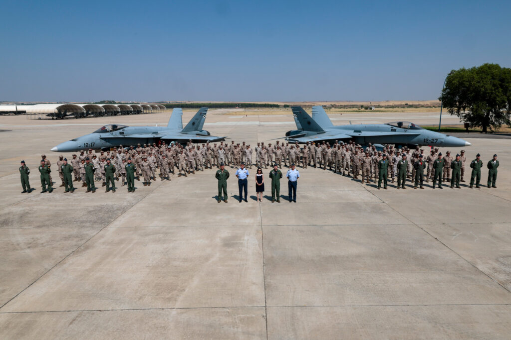The Spanish DAT Paznic contingent team with two F-18M fighter jets in the background. July 29, 2026. Photo credits: Spanish Ministry of Defense
