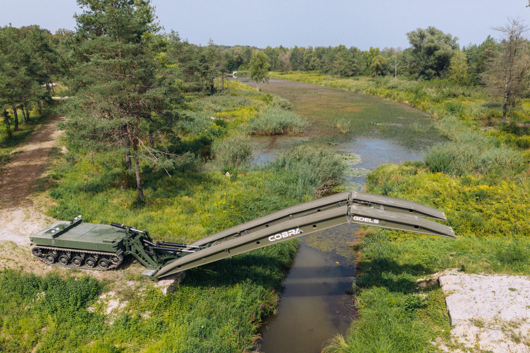 MV-8 Komodo Heavy UGV Equipped with Cobra Bridge-Laying System