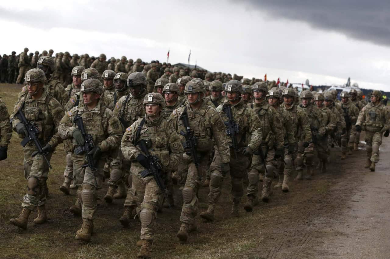 U.S. service members marching. Source: The Wall Street Journal